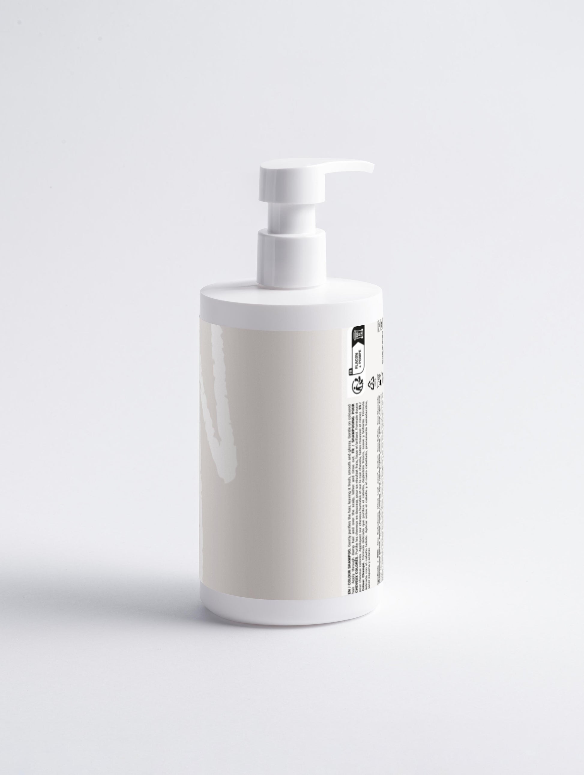 White bottle with pump on a light gray background