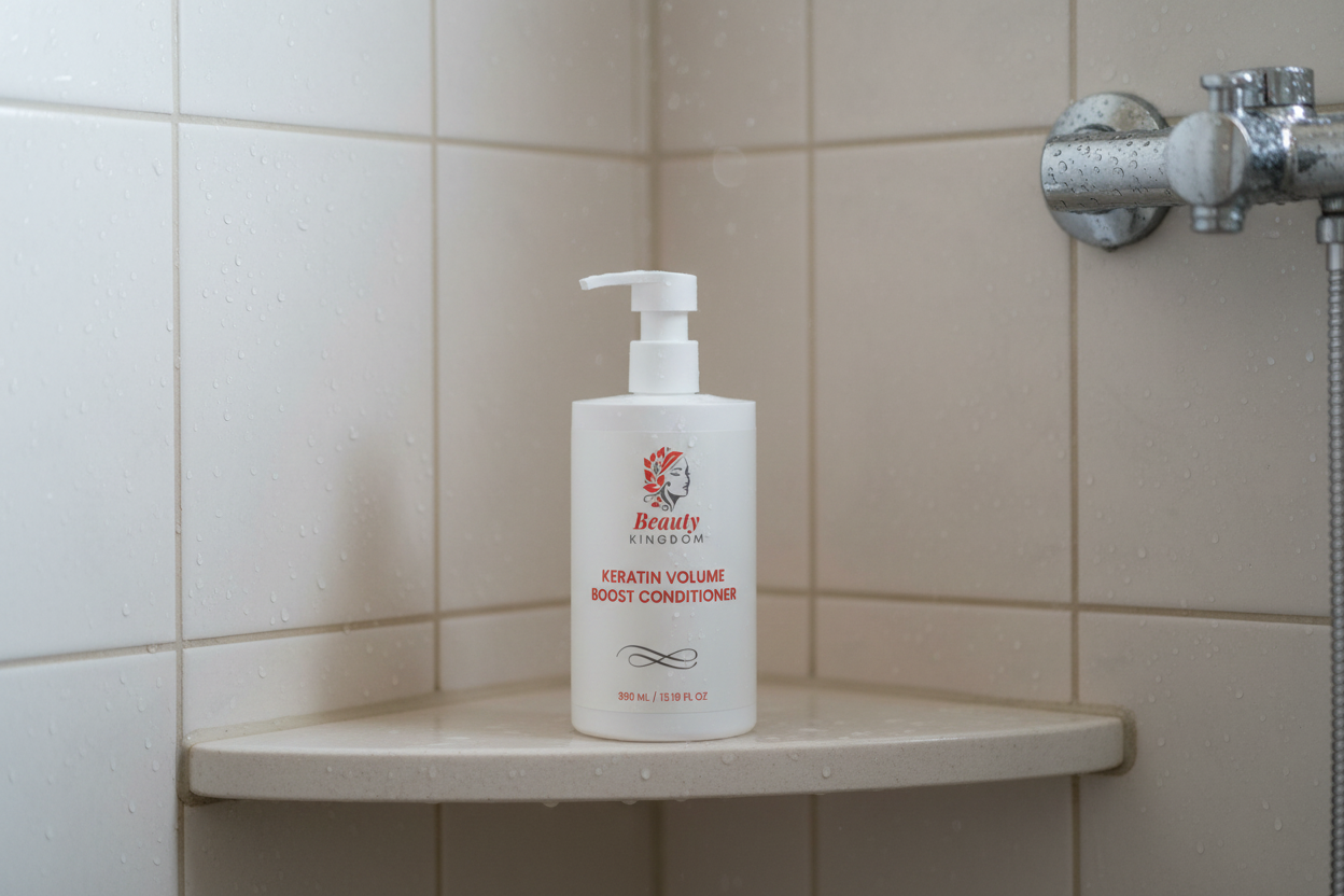 Keratin Volume Boost Conditioner Elegant White Bottle Displayed On Bathroom Shelf With Tiled Wall Background