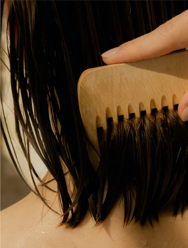 Beautiful Voluminous Hair Being Combed With Wooden Brush, Showing Results Of Keratin Volume Boost Shampoo Treatment